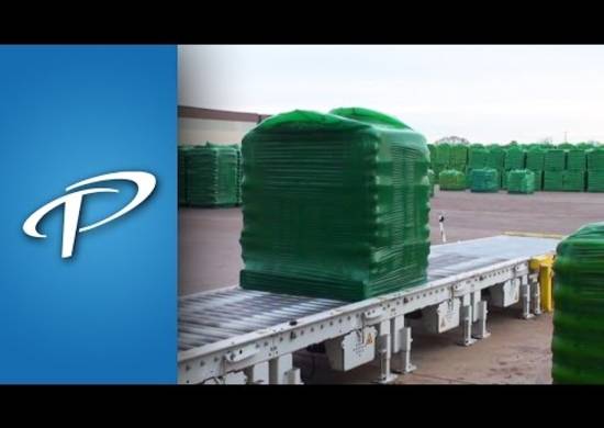 Complete_Packaging_Line_PottingSoil_2_splashimage Fully wrapped pallet being carried outdoors on a conveyor
