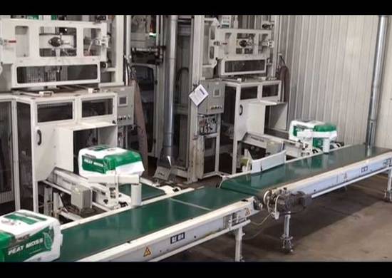 Complete Packaging Line - Bales Peat Moss_splashimage Compression bagging - peat moss bales on conveyor