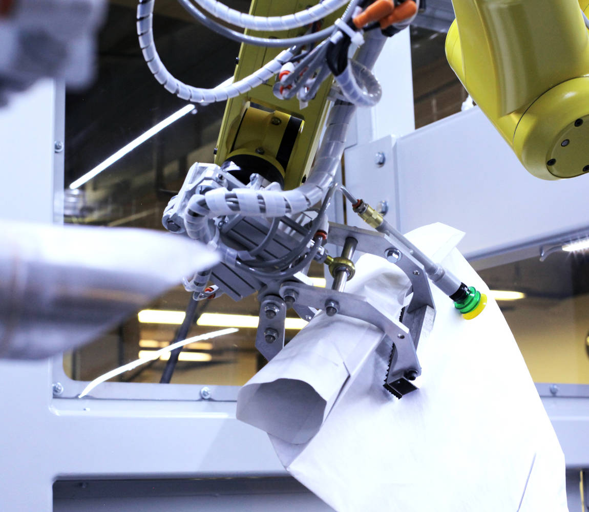 Encompass valve bagger - bag placer