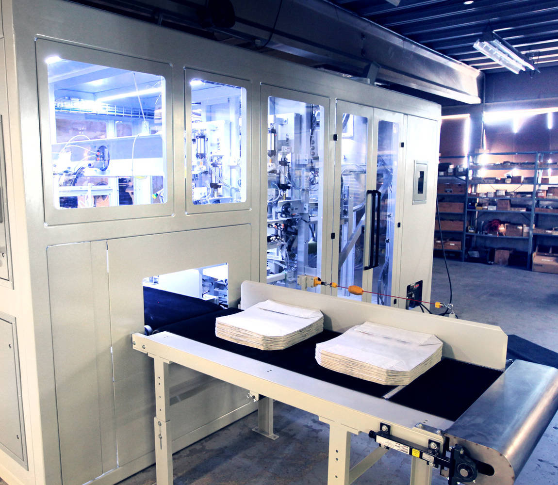 valve-bag-filler-Encompass-video-1_splashimage Emcompass valve bag filler - bags on conveyor