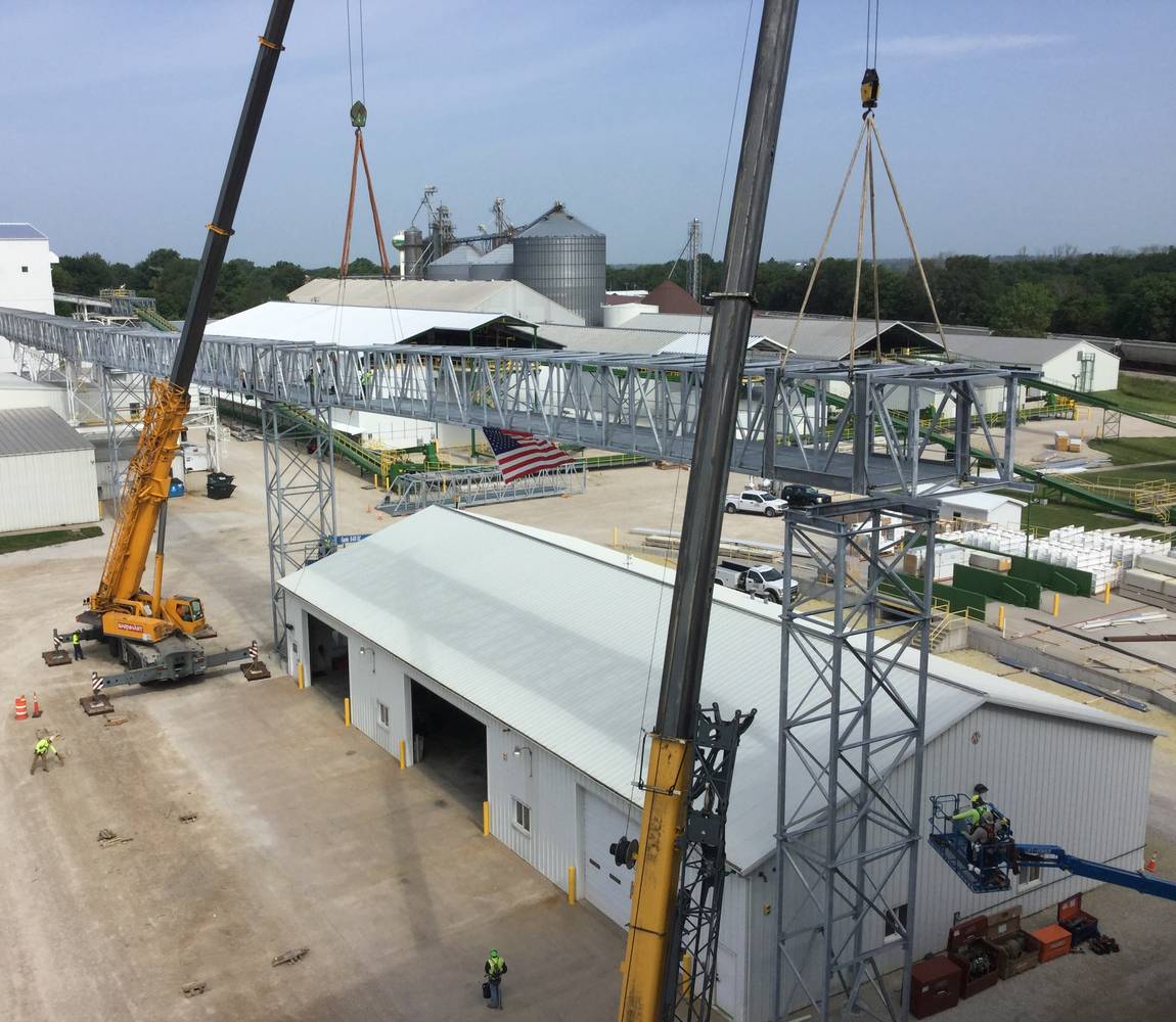Agricultural facility construction with cranes