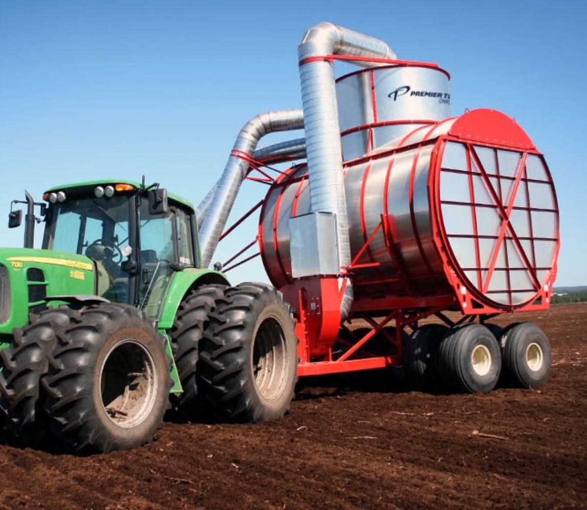 Two head vacuum peat harvesting machine with tractor