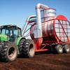 Two head vacuum peat harvesting machine with tractor
