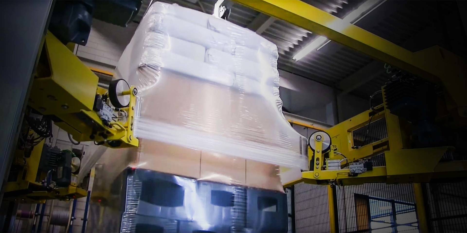 main_video - stretch_all_splashimage Stretch hooder wrapping a pallet full of boxes